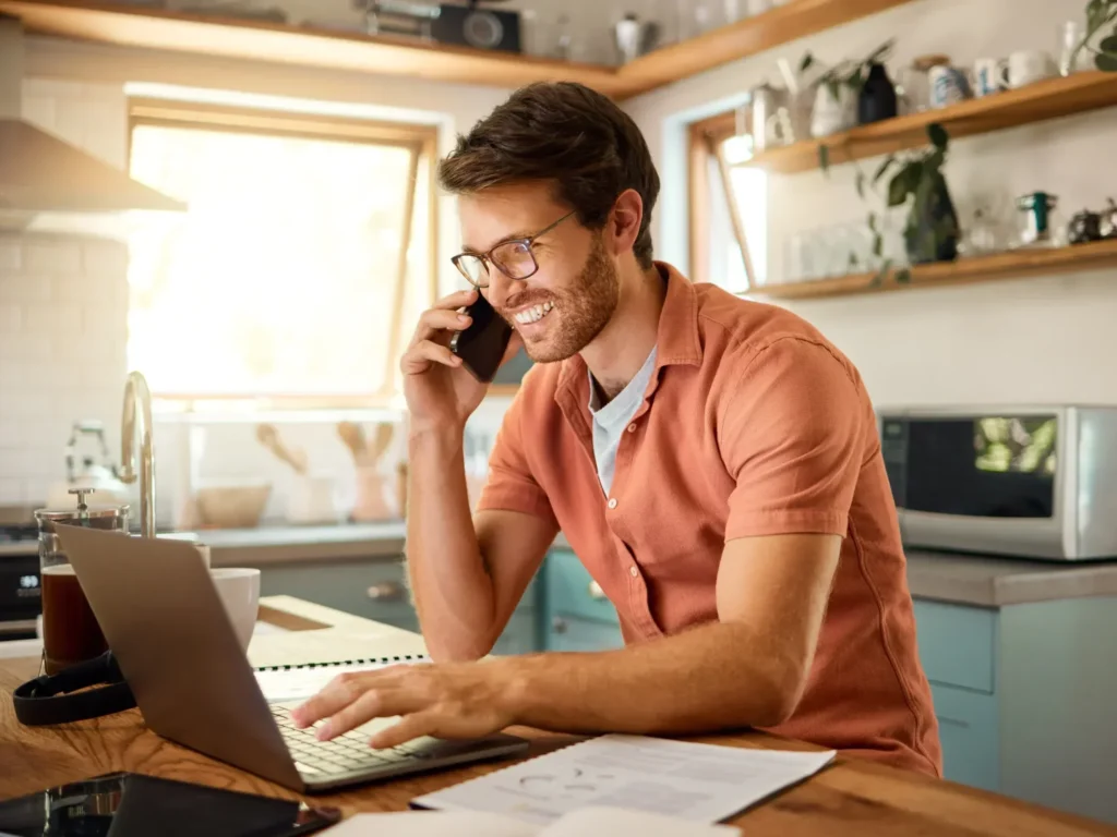 Man working on laptop at home.