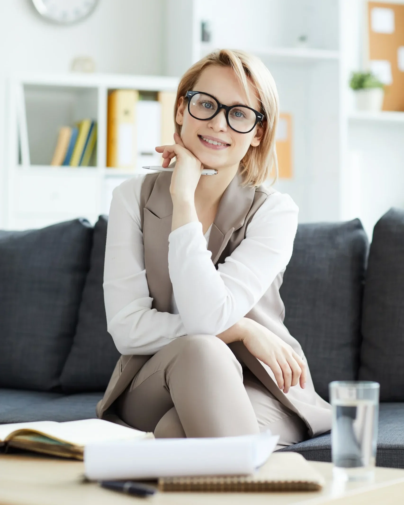 Female mental health therapist smiling during an outpatient counseling session.