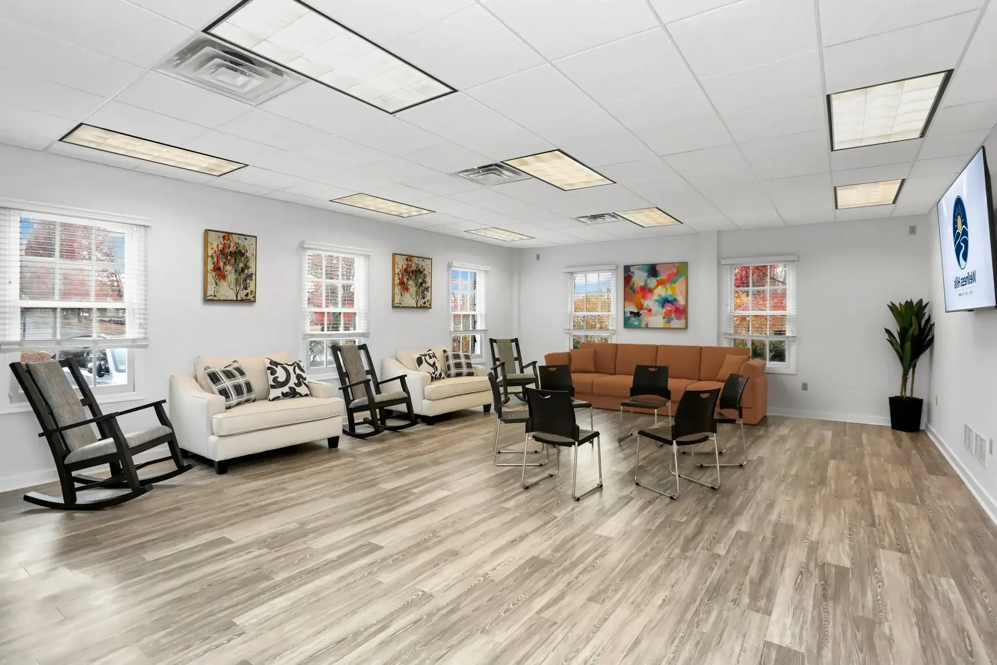 Large group therapy room at Wellness Hills Mental Health Treatment with chairs arranged for an IOP session.