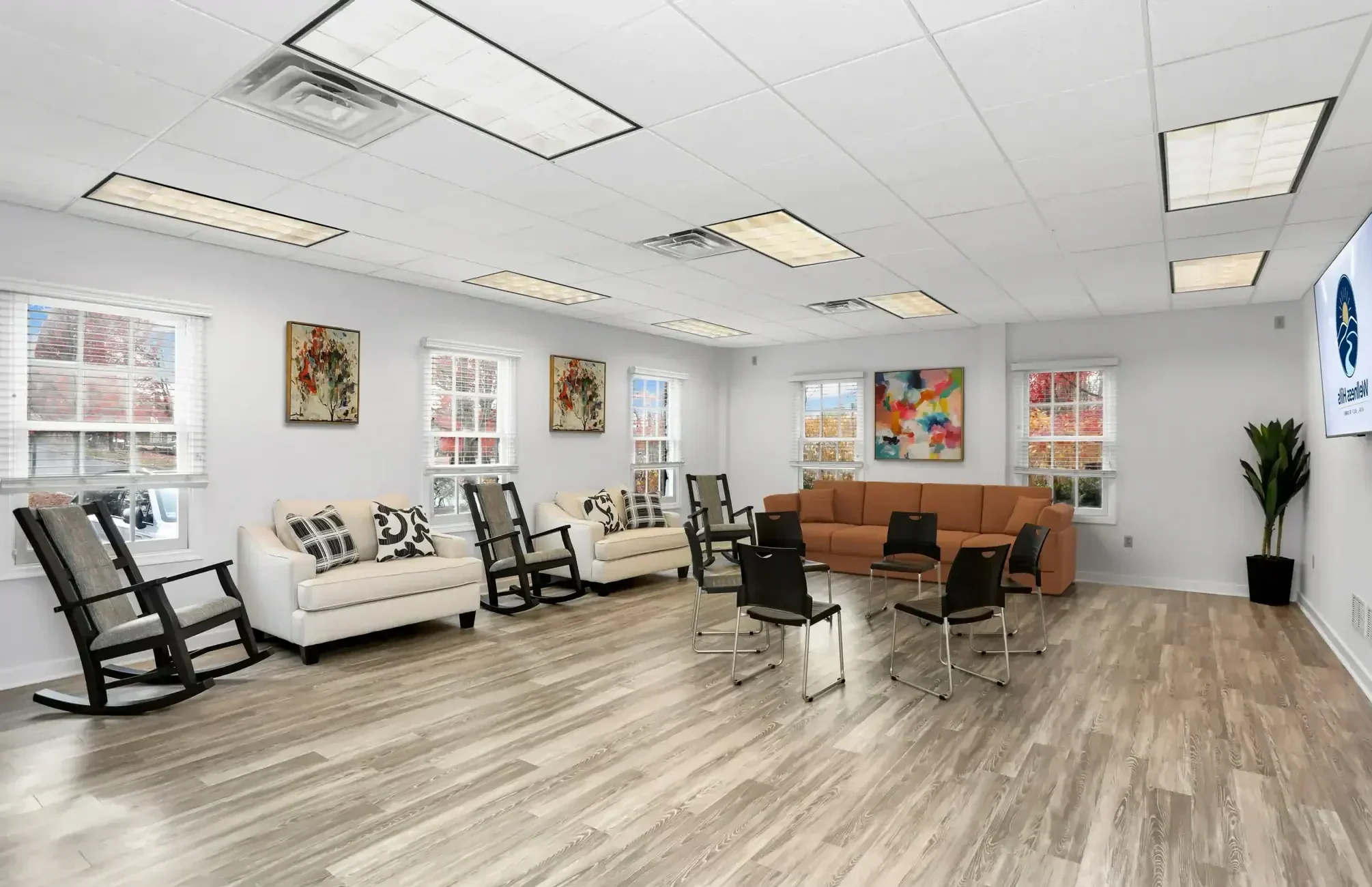 Large group therapy room at Wellness Hills Mental Health Treatment with chairs arranged for an IOP session.