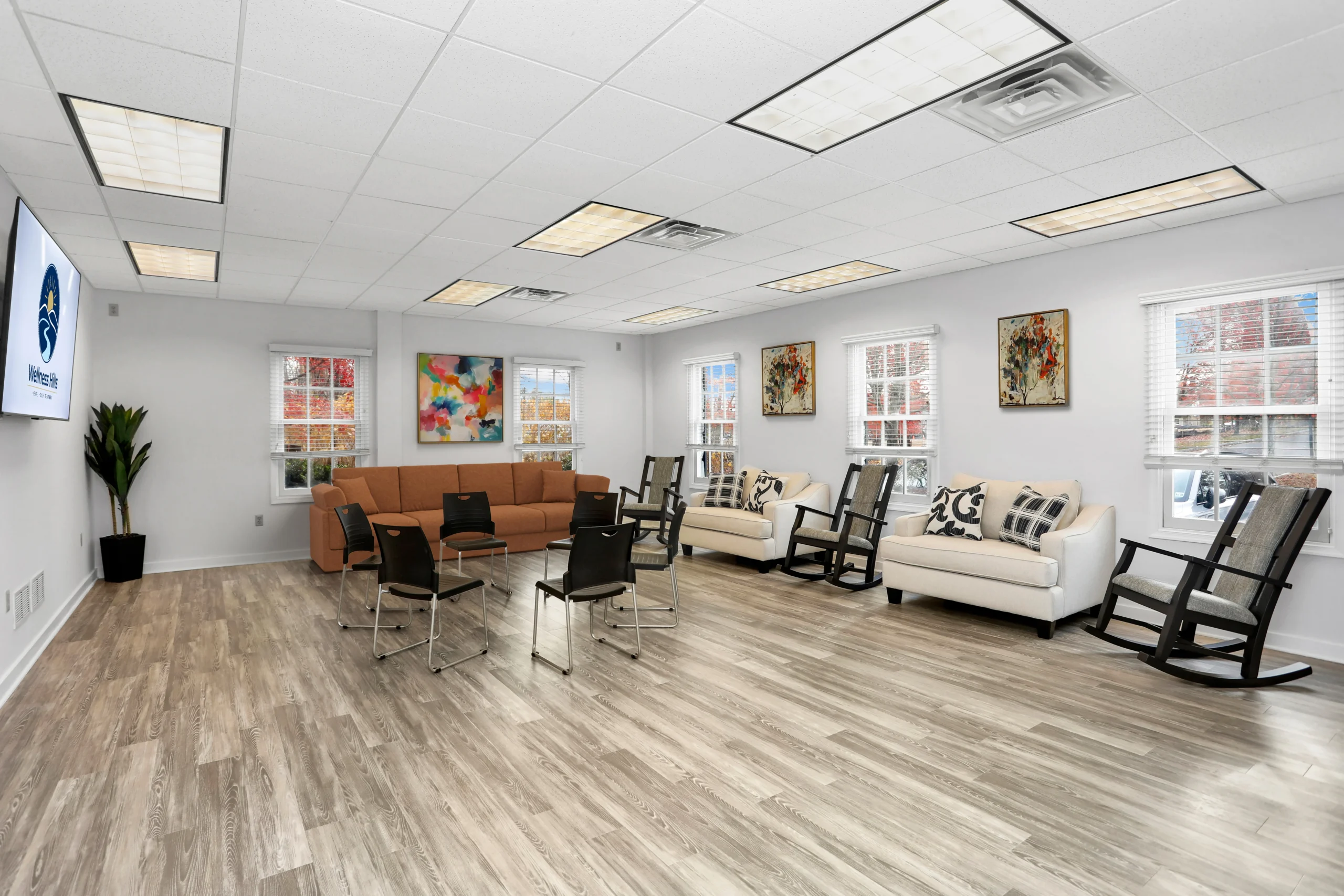 Large group therapy room at Wellness Hills Mental Health Treatment with chairs arranged for an IOP session.