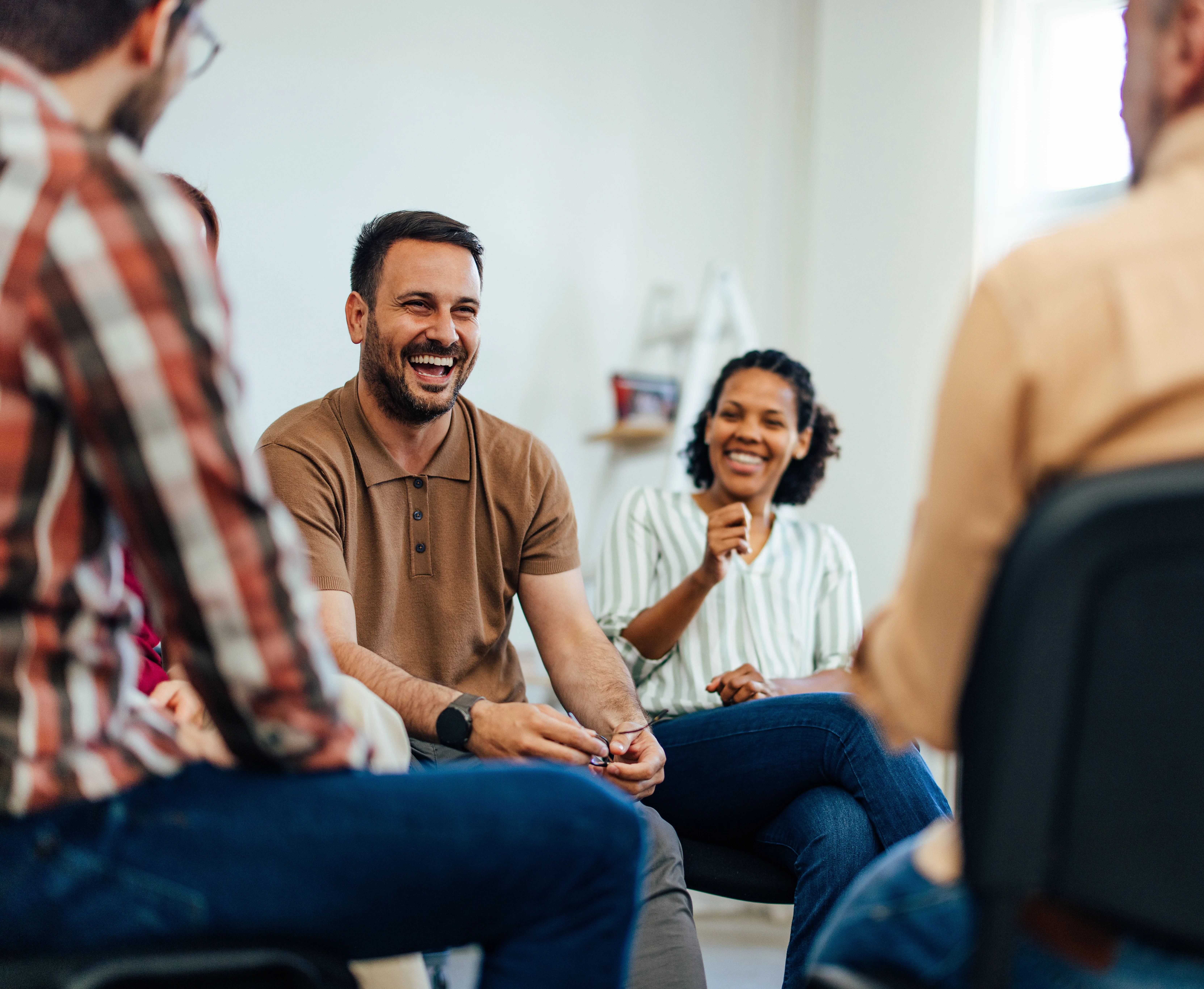 People happy and smiling in an iop mental health program.