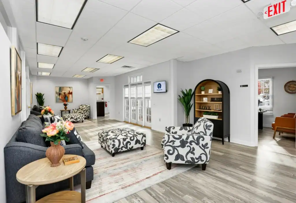 Welness Hills common are with modern love seats and accent chairs.