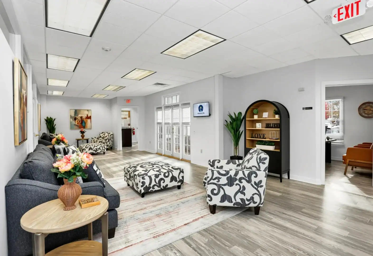 Welness Hills common are with modern love seats and accent chairs.