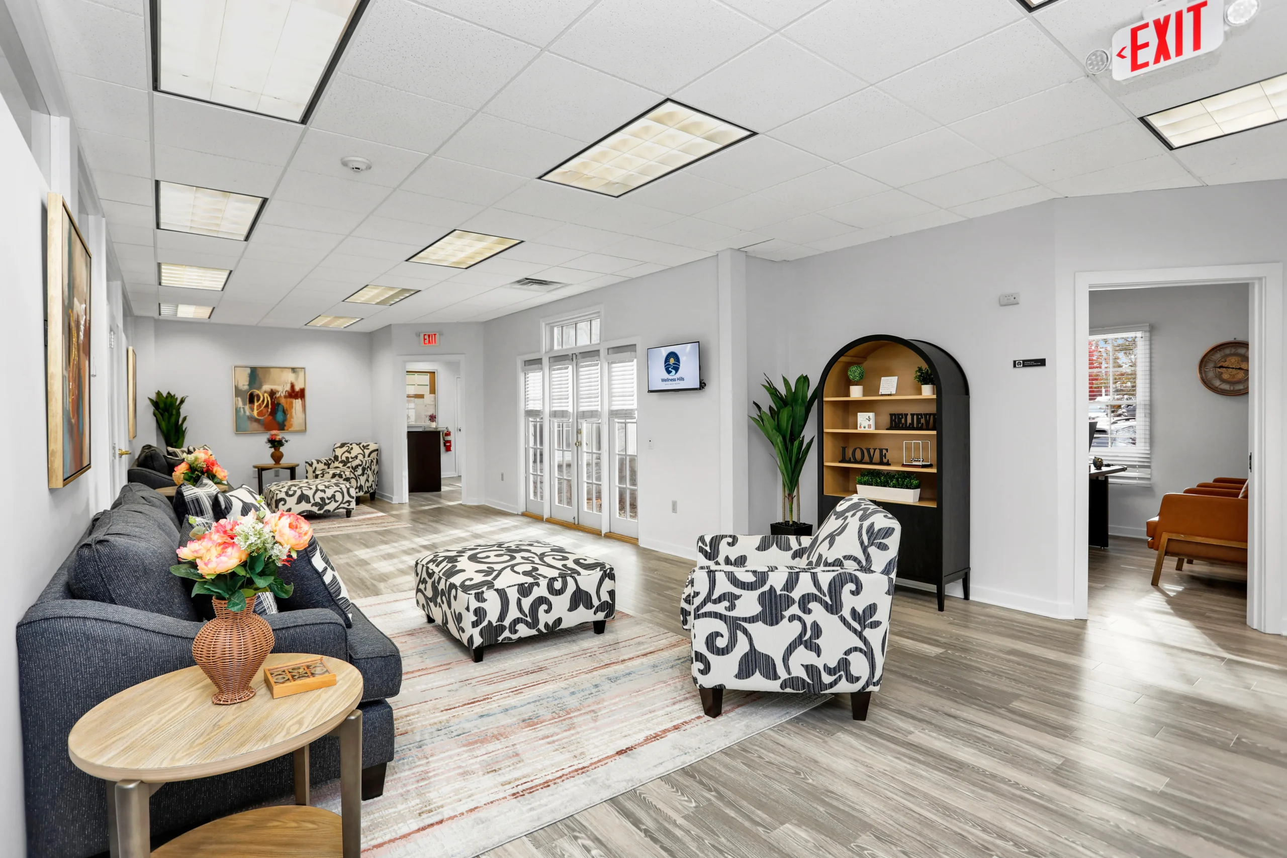 Welness Hills common are with modern love seats and accent chairs.