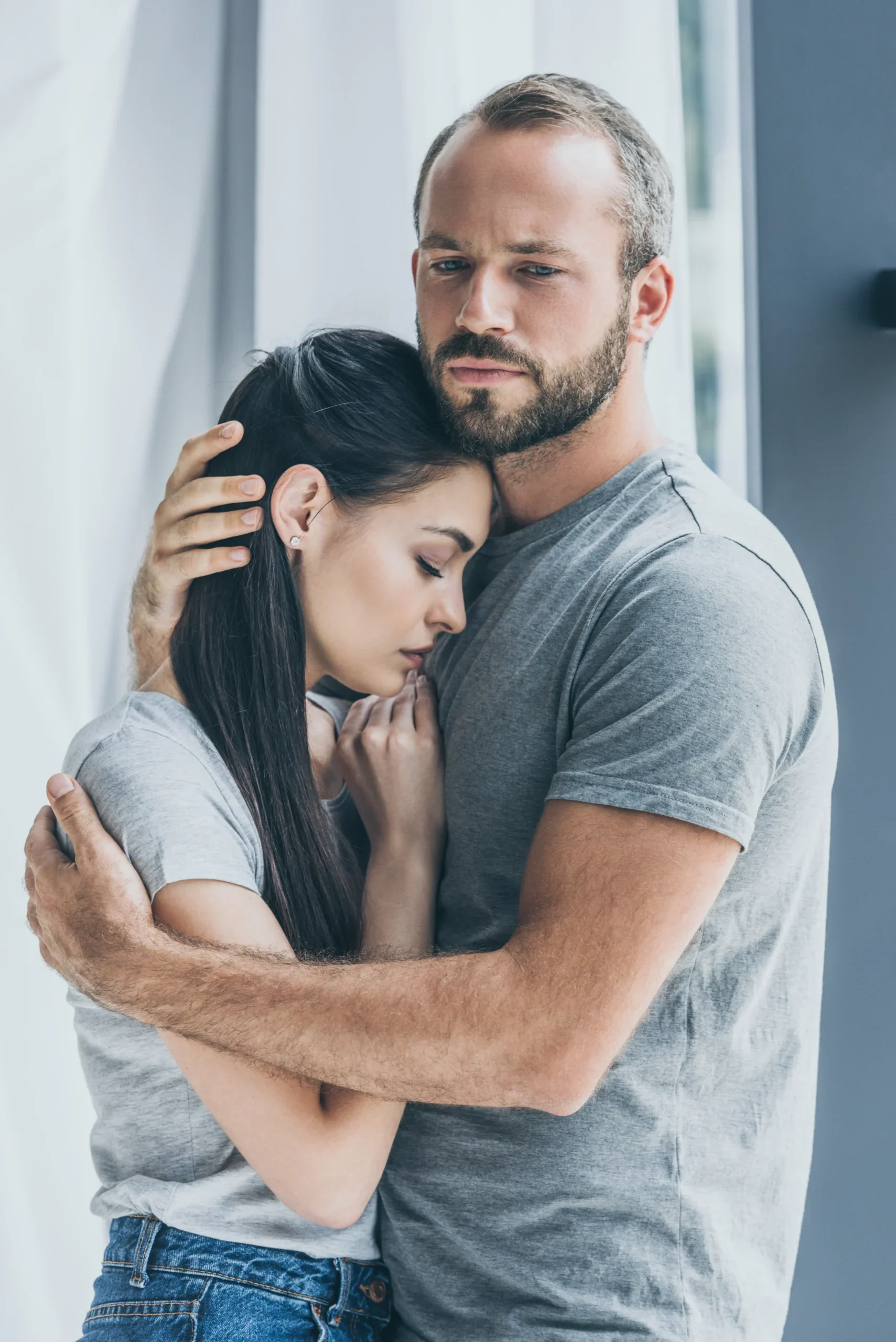 Man comforting a woman who is upset