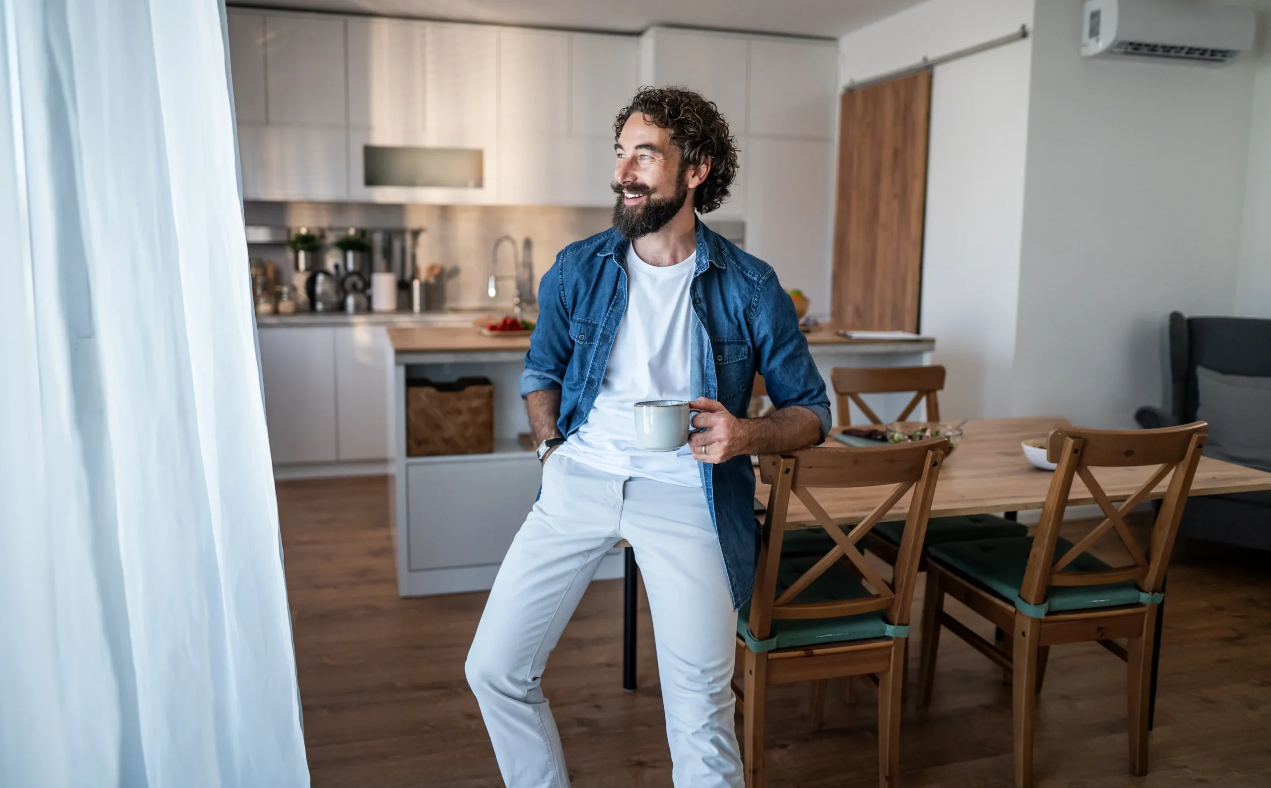 A man drinking coffee at peace with himself.