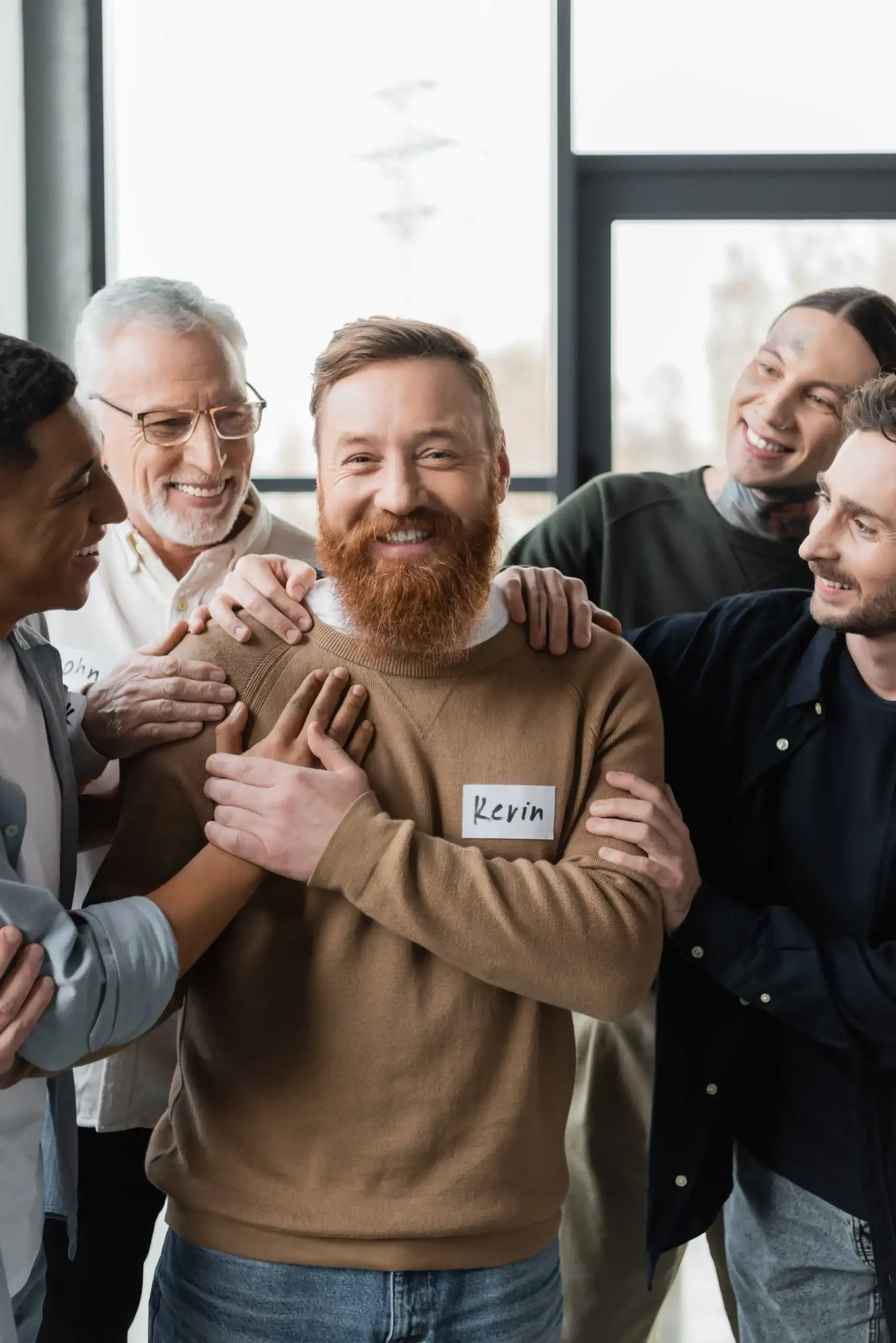 Men offering support during a group therapy session