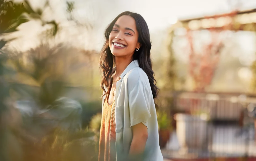 Relaxed woman enjoying fresh air and sunlight in a peaceful outdoor setting
