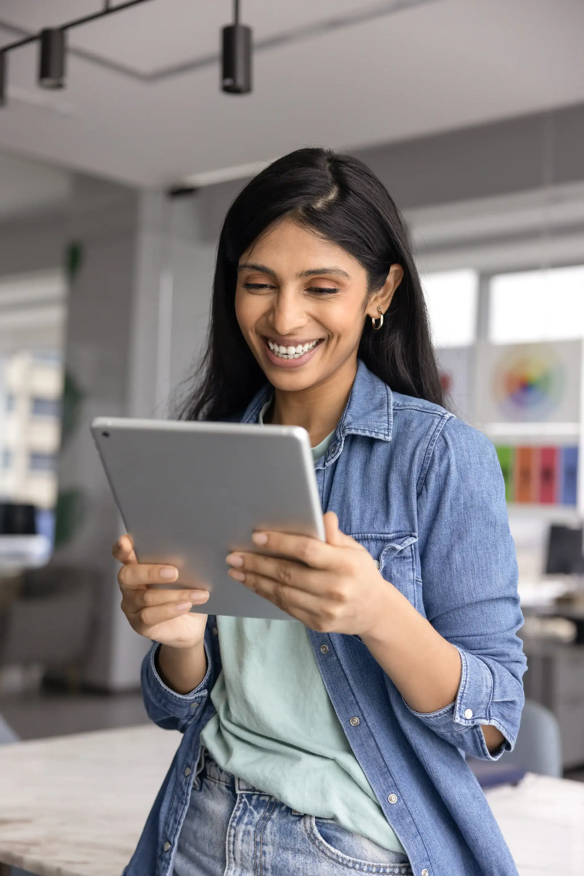 Woman using a tablet to schedule a therapy appointment