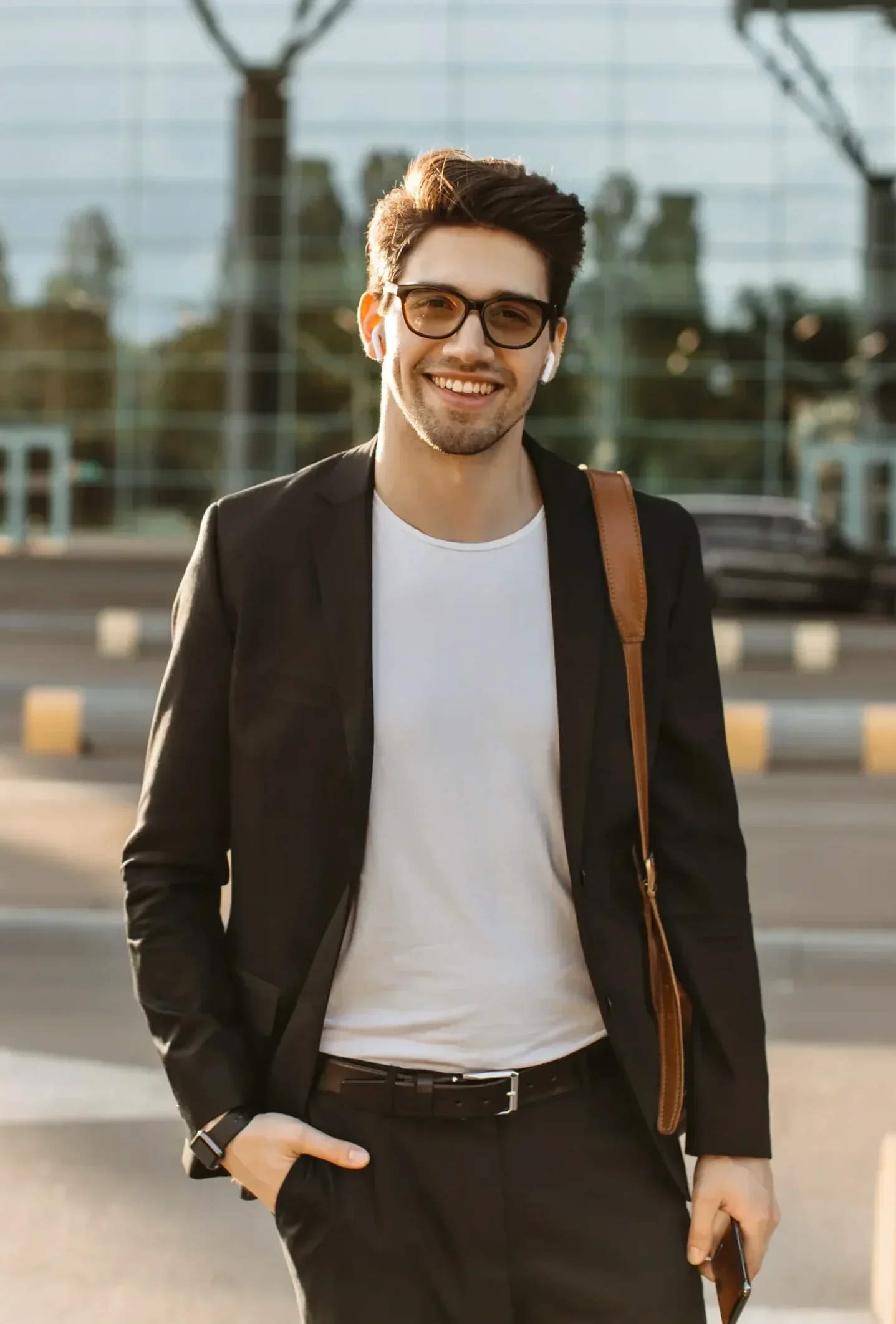 Young adult smiling outdoors, representing mental health support and recovery.