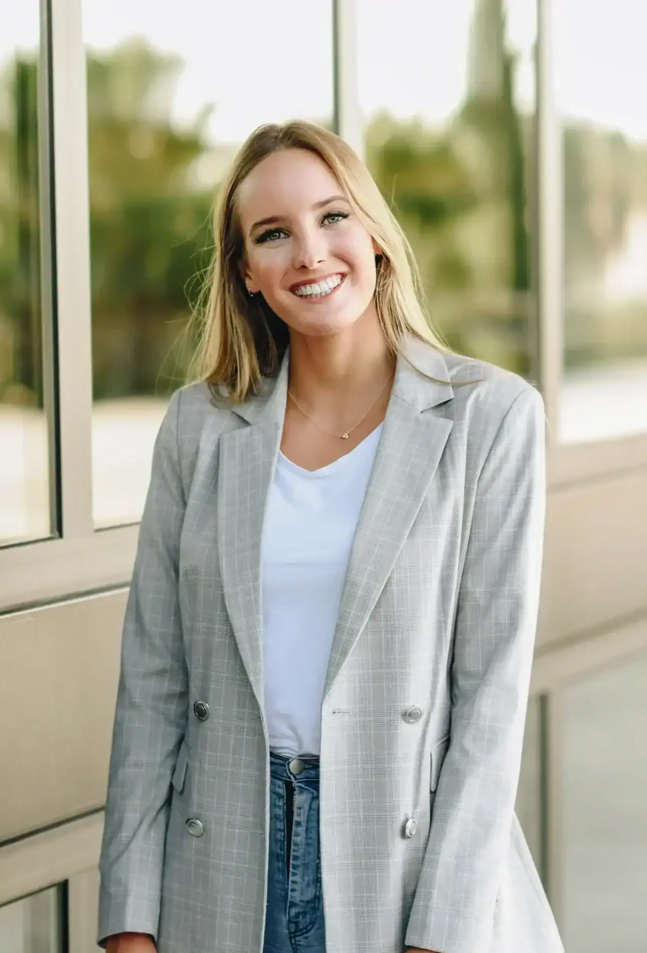 Woman smiling outside a treatment center building
