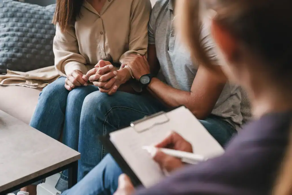 Family receiving relationship support during a therapy appointment