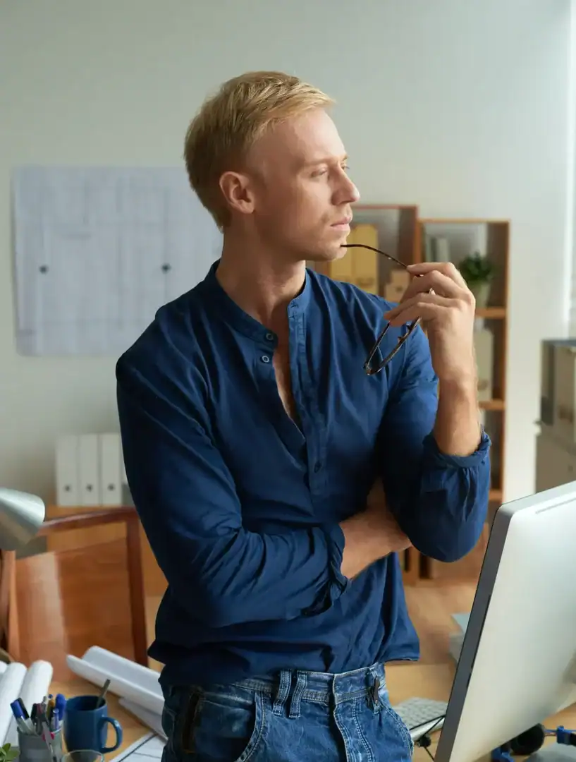 Man looking overwhelmed while coping with mental health challenges at home or work