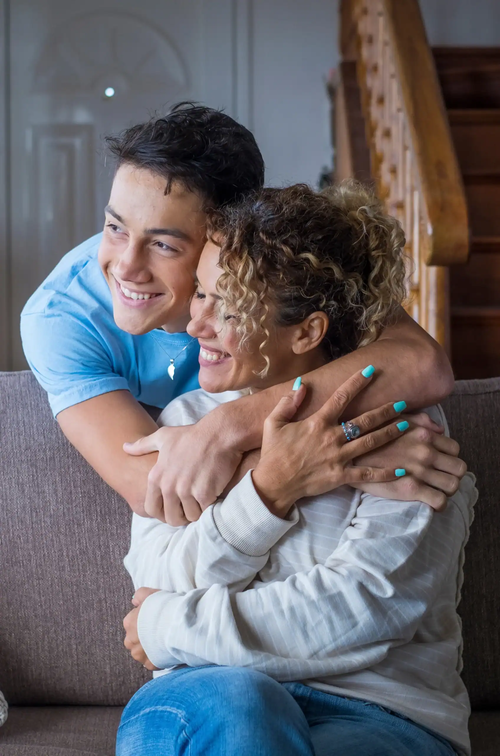 Mother and son sharing a hug indoors