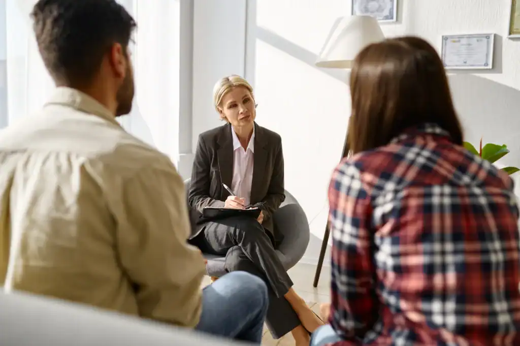 Relationship counseling session with a couple and therapist in an office