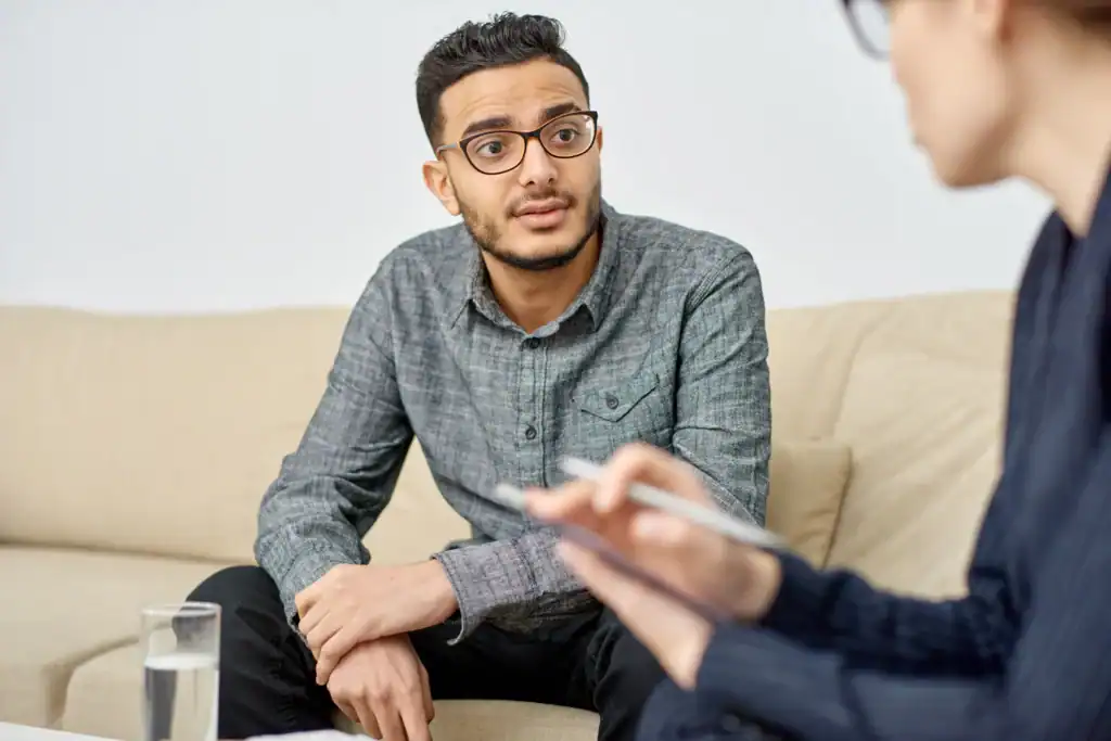 Client talking with a therapist during a mental health counseling session