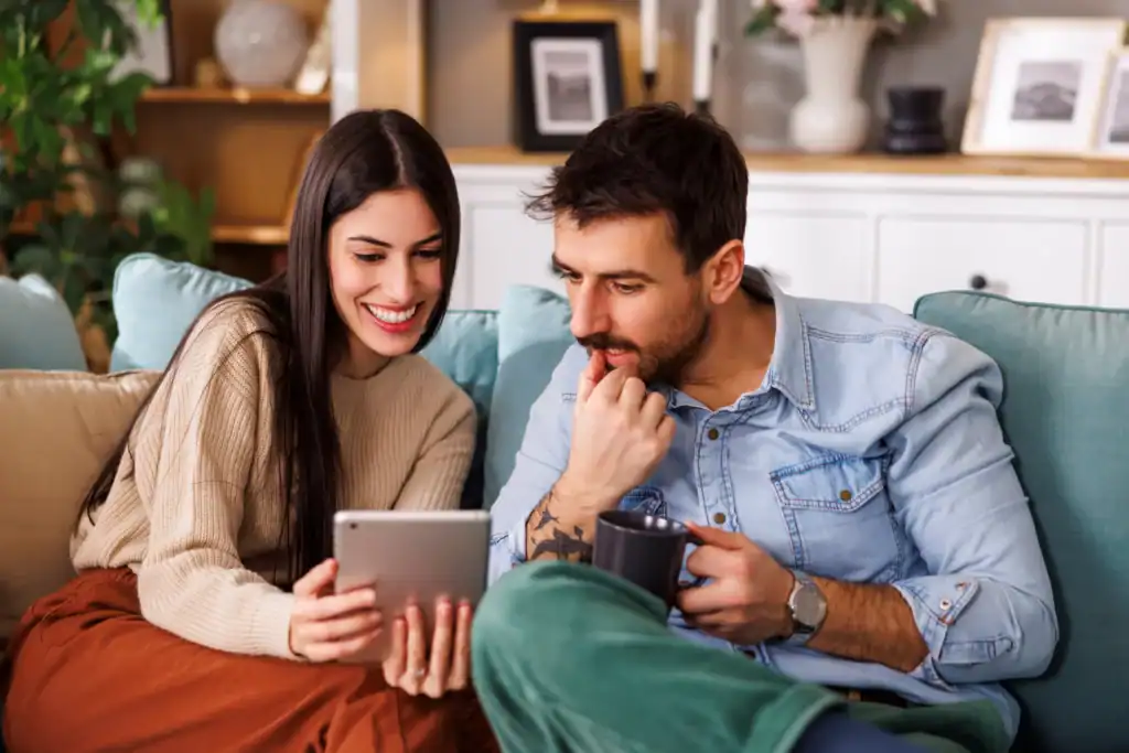 A couple at home reviewing depression treatment insurance coverage options