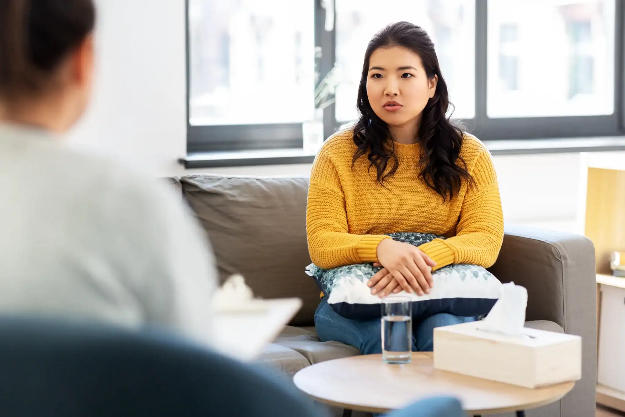 A woman attending an evidence-based therapy session for depression at a mental health clinic