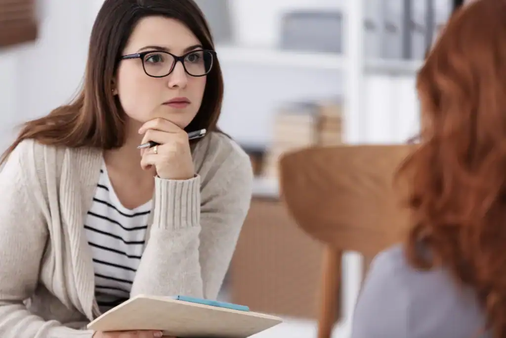 Therapist listening to a client during an individual depression treatment session