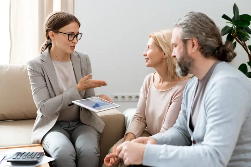 Reviewing insurance coverage and treatment costs with two adults seeking depression treatment