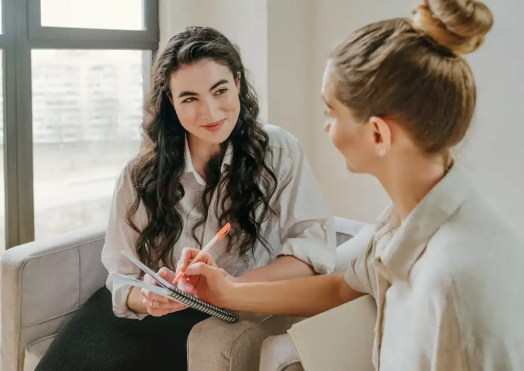 Client meets with a therapist during a calm outpatient mental health intake session.