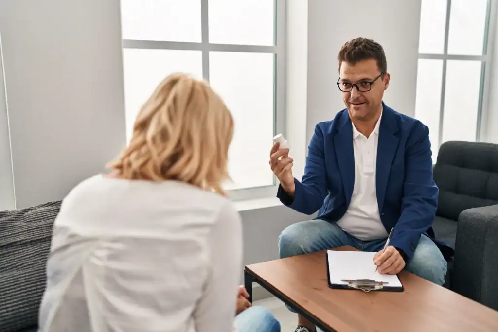 Clinician explaining antidepressant medication to a patient during an office appointment.