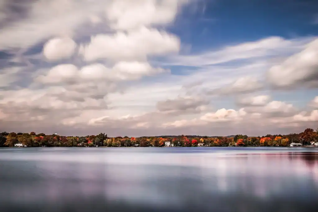 Autumn foliage and lakefront homes along Lake Parsippany in Parsippany-Troy Hills, New Jersey, at dusk.